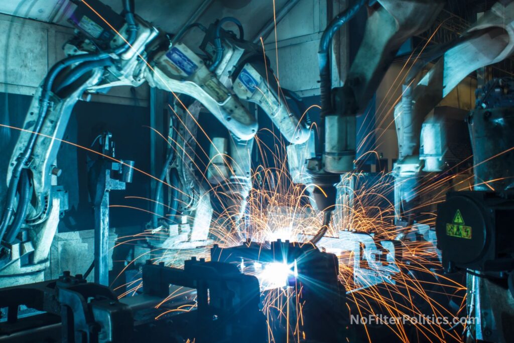 Robots welding in a car factory